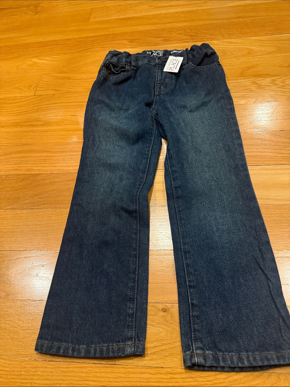 NWT The children place boys bootcut jeans size 5T .